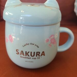 Sakura Blue Cat Mug with Floral Design